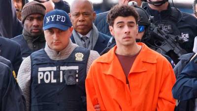 Suspect in health CEO killing charged with murder in New York