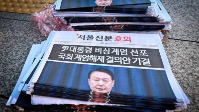 South Korean president pressed to resign over martial law bid