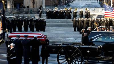 Carter body flown to snowy Washington for state funeral