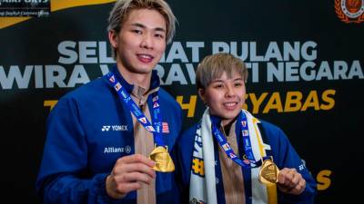 Ibu bapa bangga kejayaan Tang Jie-Ee Wei juara dunia badminton
