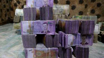 Syria to revalue currency by removing two zeros to restore stability