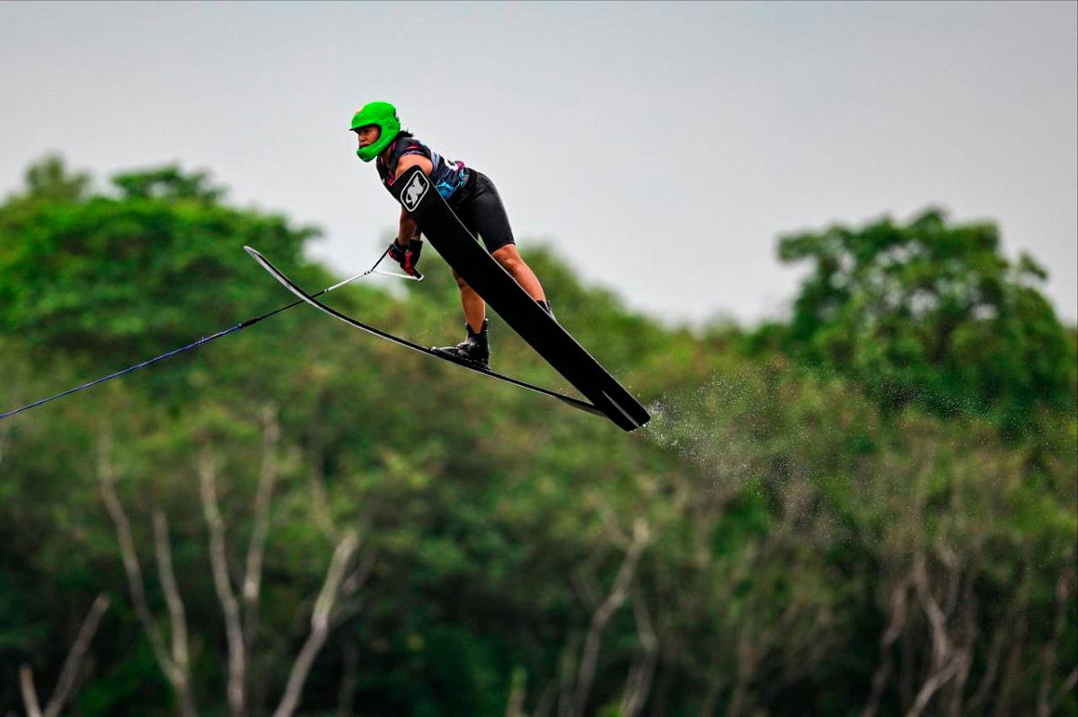 Aaliyah soaring into the sky in her jump event