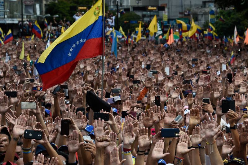 Demonstrators in Caracas rally against Nicolas Maduro, who the United States has declared to be illegimate as the president of Venezuela. — AFP