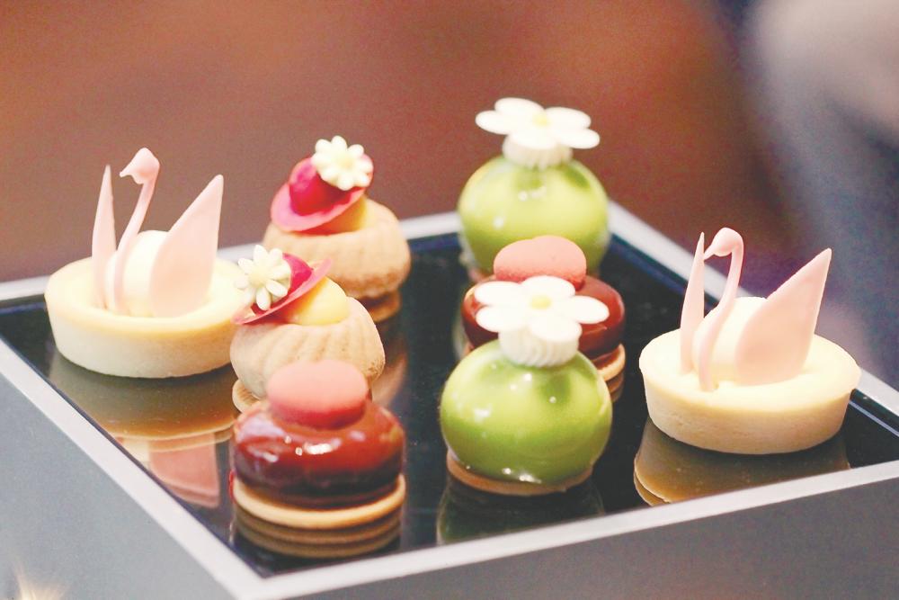 $!Stunning petit gateau - Swan cheese tart and cherry pistachio daisy available from the InterContinental Kuala Lumpur.