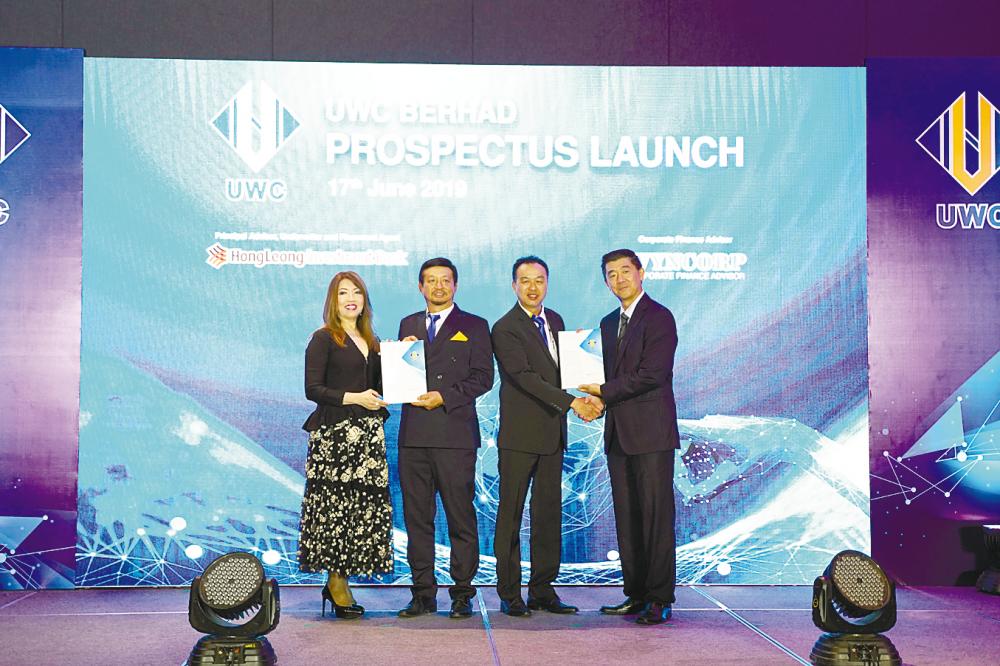 From left: Hong Leong Investment Bank Bhd (HLIB) group managing director/CEO Lee Jim Leng, Ng, UWC COO Lau Chee Kheong and HLIB head of equity markets Phang Siew Loong at the prospectus launch today.