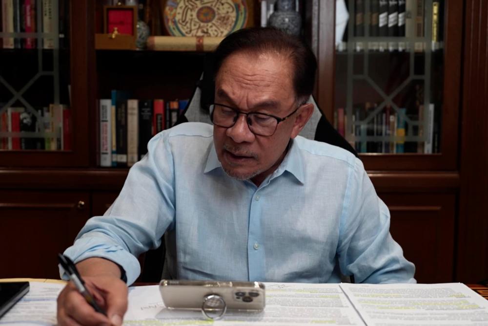 Prime Minister Datuk Seri Anwar Ibrahim during a phone conversation with Brazil President Luiz Inacio Lula da Silva - Anwar Ibrahim/FBPIX