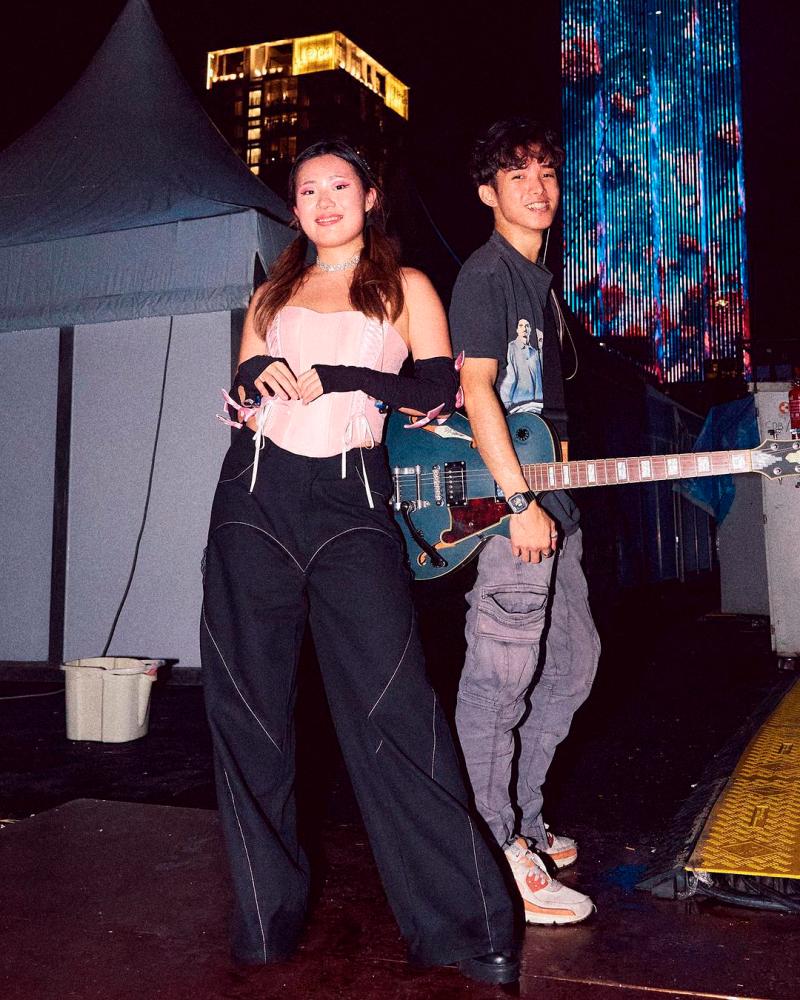 $!Tan (left) and her producer-boyfriend Lim.