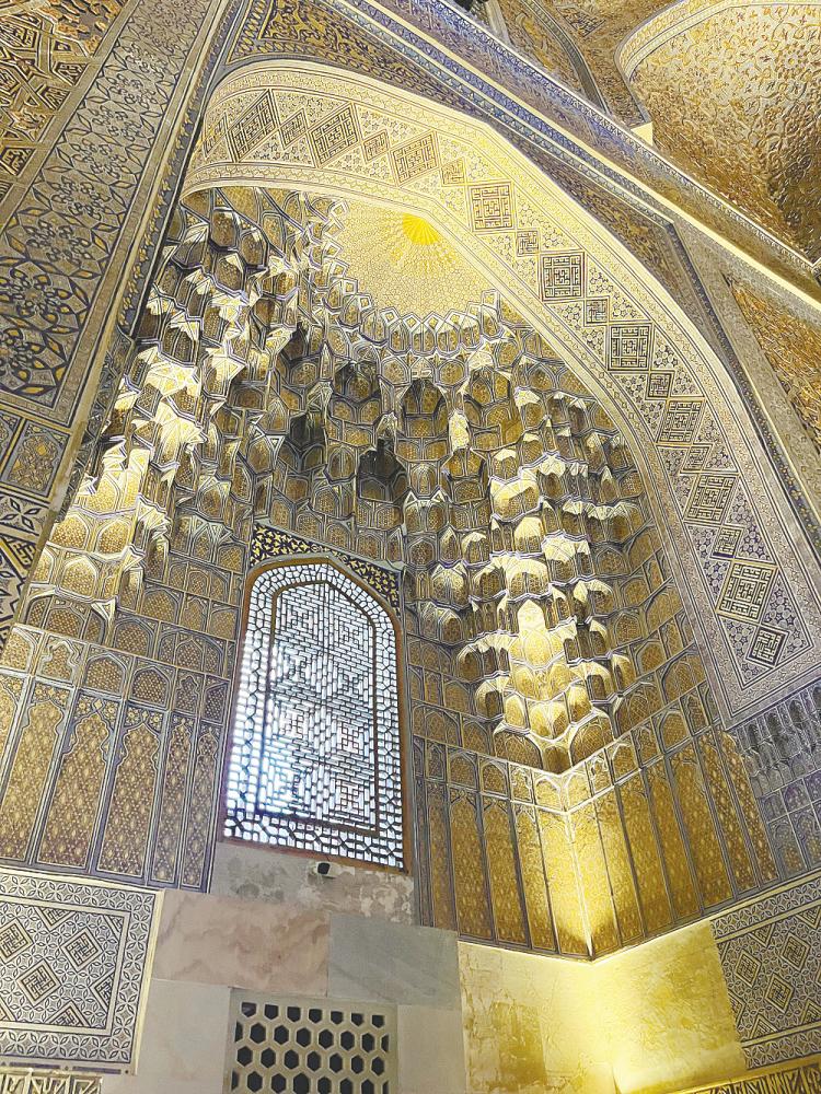 $!Golden ornamental muqarna inside the mausoleum.