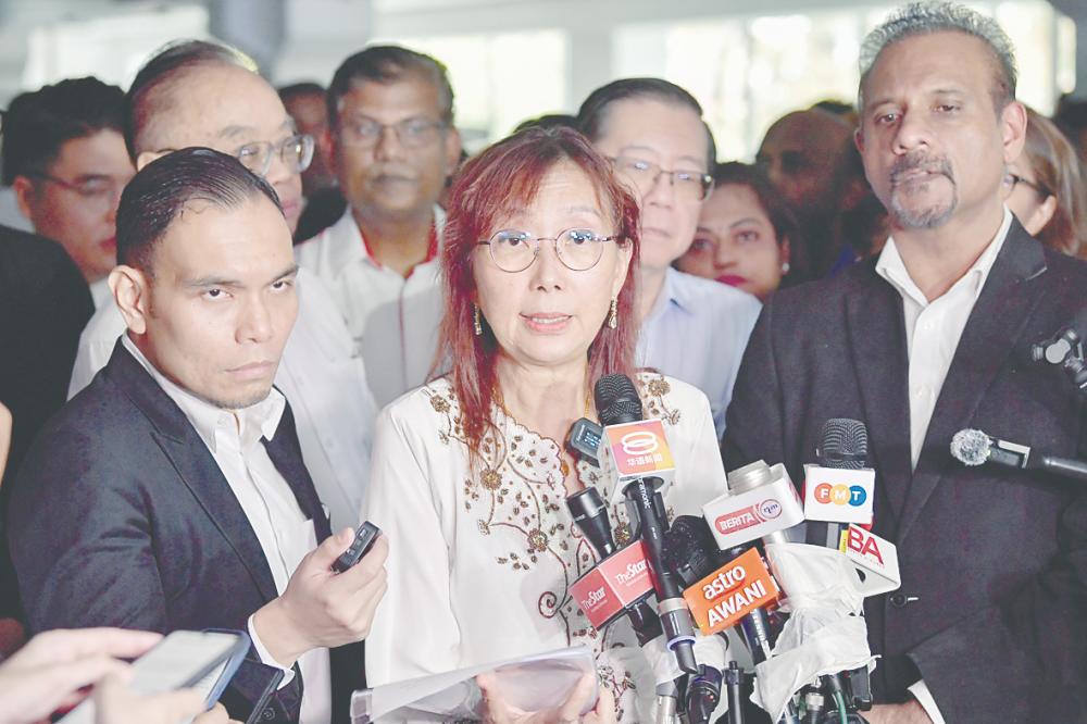 Kok speaking to media representatives after having her statement recorded at Bukit Aman yesterday. – BERNAMAPIC