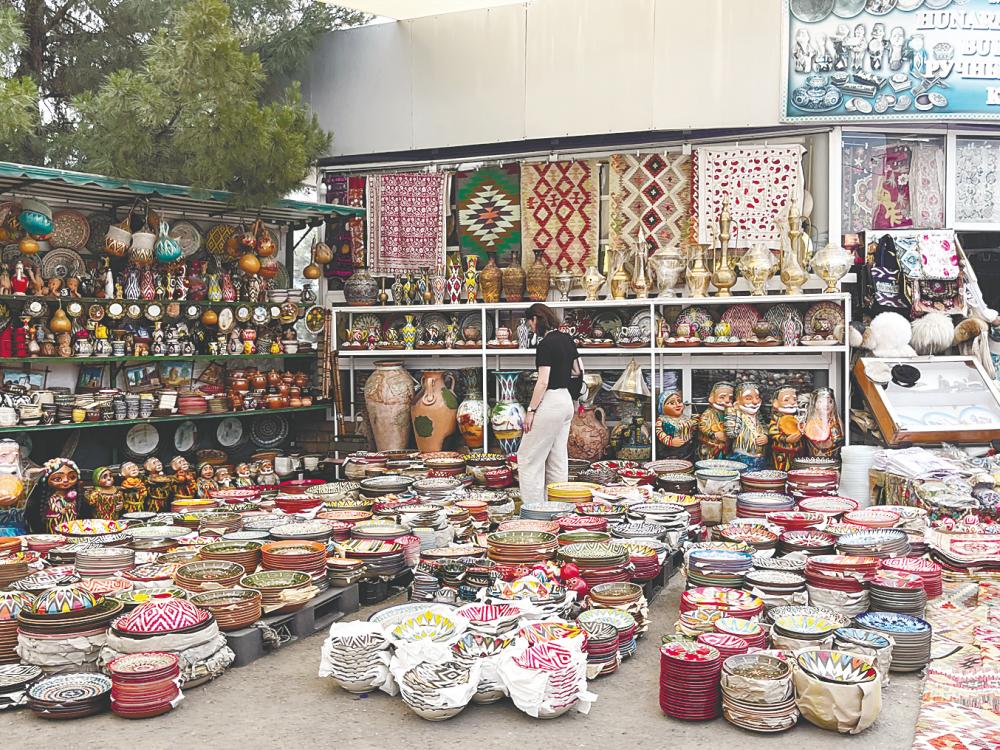 $!Souvenir shops are aplenty at Chorsu Bazaar, selling everything from Bukhara plates to table cloths.