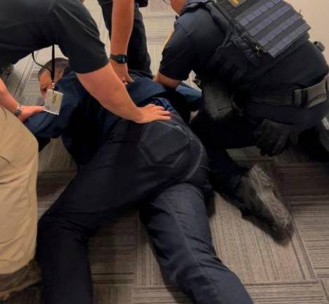 U.S. Senator Alex Padilla (D-CA) is held down on the floor - Office of the Senator Alex Padilla/Handout via REUTERS
