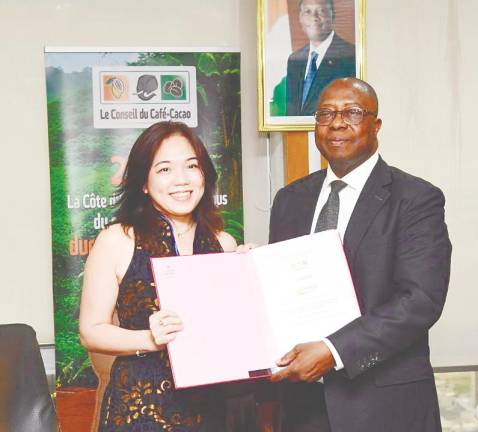 Guan Chong Bhd commercial director Elsa Tay See Min and Coffee-Cocao Council general manager Yves Brahima Koné during the signing ceremony.