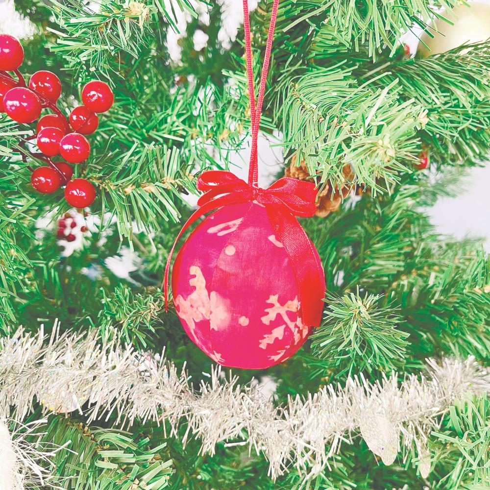 $!A Christmas bauble in batik fabric.