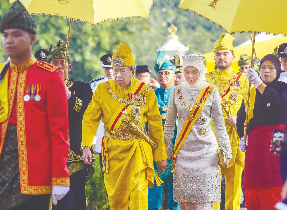 Sultan Sharafuddin and Tengku Permaisuri Norashikin arriving with Tengku Amir Shah for the ceremony yesterday. – ADAM AMIR HAMZAH/THESUN