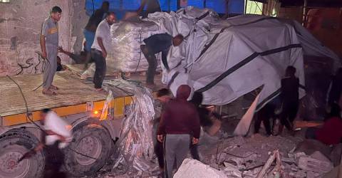 Aid trucks enter Gaza after delays, as pressure mounts on Israel