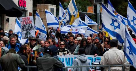 Israel opposition urges general strike over security chief ouster 