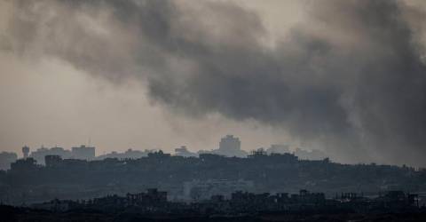 Israel approves Gaza ceasefire, carries out more attacks