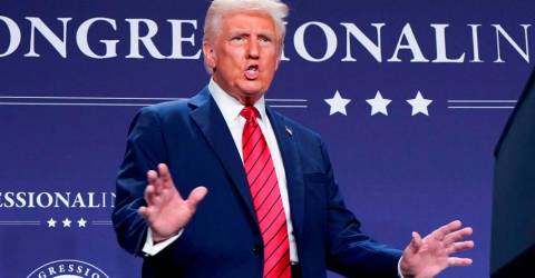 Judge weighs temporary block of Trump’s freeze on grants, loans