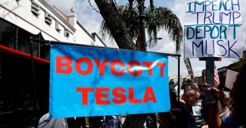 Protesters denounce Musk at Tesla dealerships in US, Europe