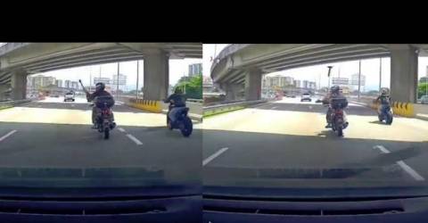 Motorcyclist throws hammer at car during aggression at the wheel