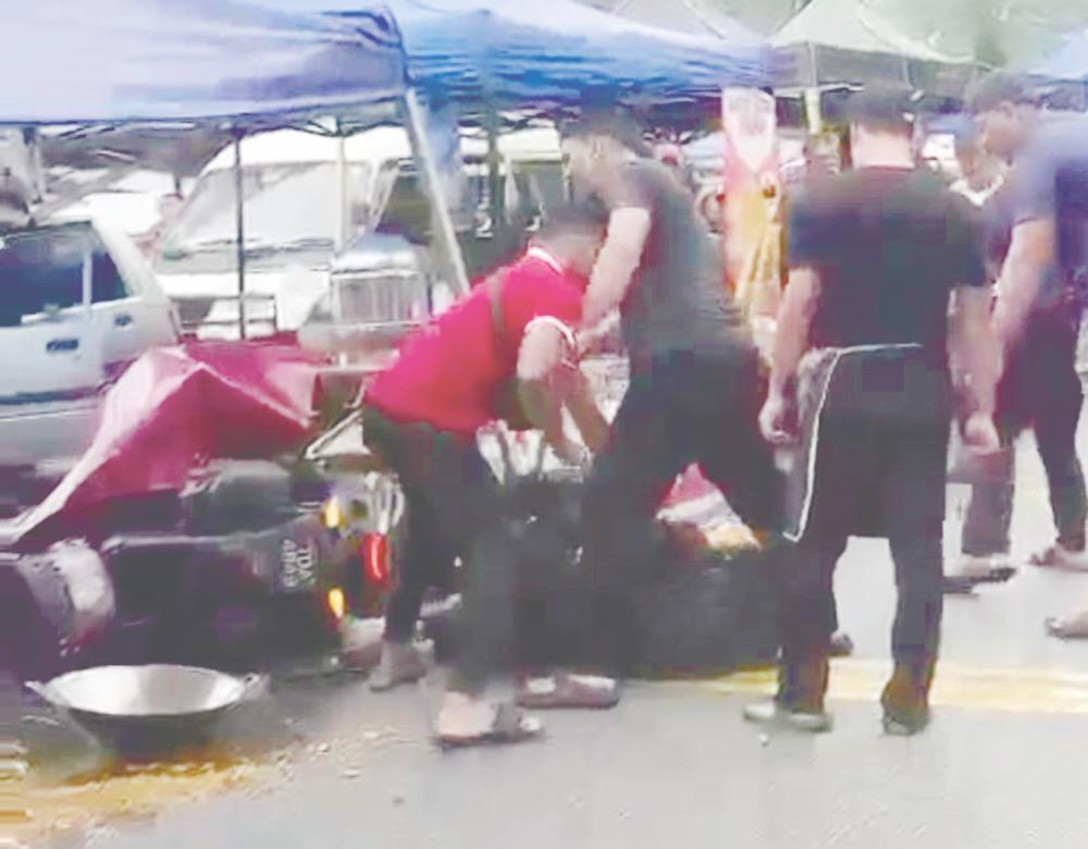 Screenshot from video of incident showing PwD being beaten while lying on ground.