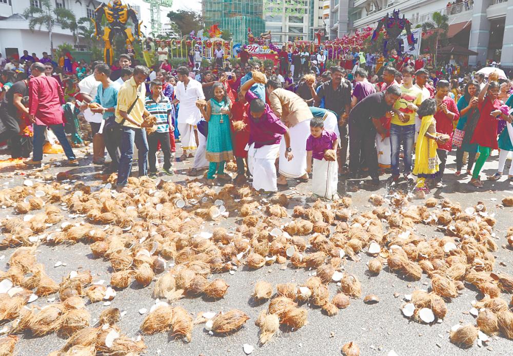 Coconuts are integral to Hindu rituals, symbolising the breaking of one’s ego and serving as offerings to the gods, making them indispensable to the festivities. – MASRY CHE ANI/THESUN