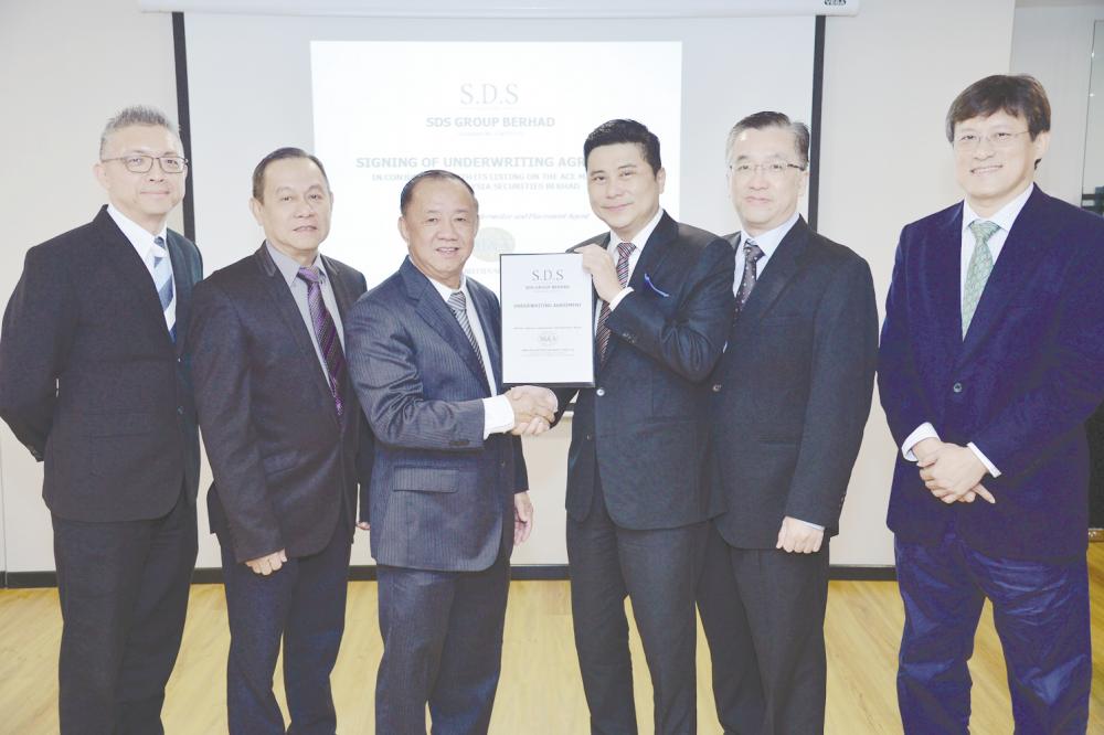 From left: M&amp;A Securities Sdn Bhd head of corporate finance Gary Ting, SDS Group Bhd executive director Tan Kim Chai, managing director Tan Kim Seng, M&amp;A Securities managing director of corporate finance Datuk Bill Tan, executive director/head of operations Goh Hock Jin and SDS Group chairman Lim Pang Kiam.