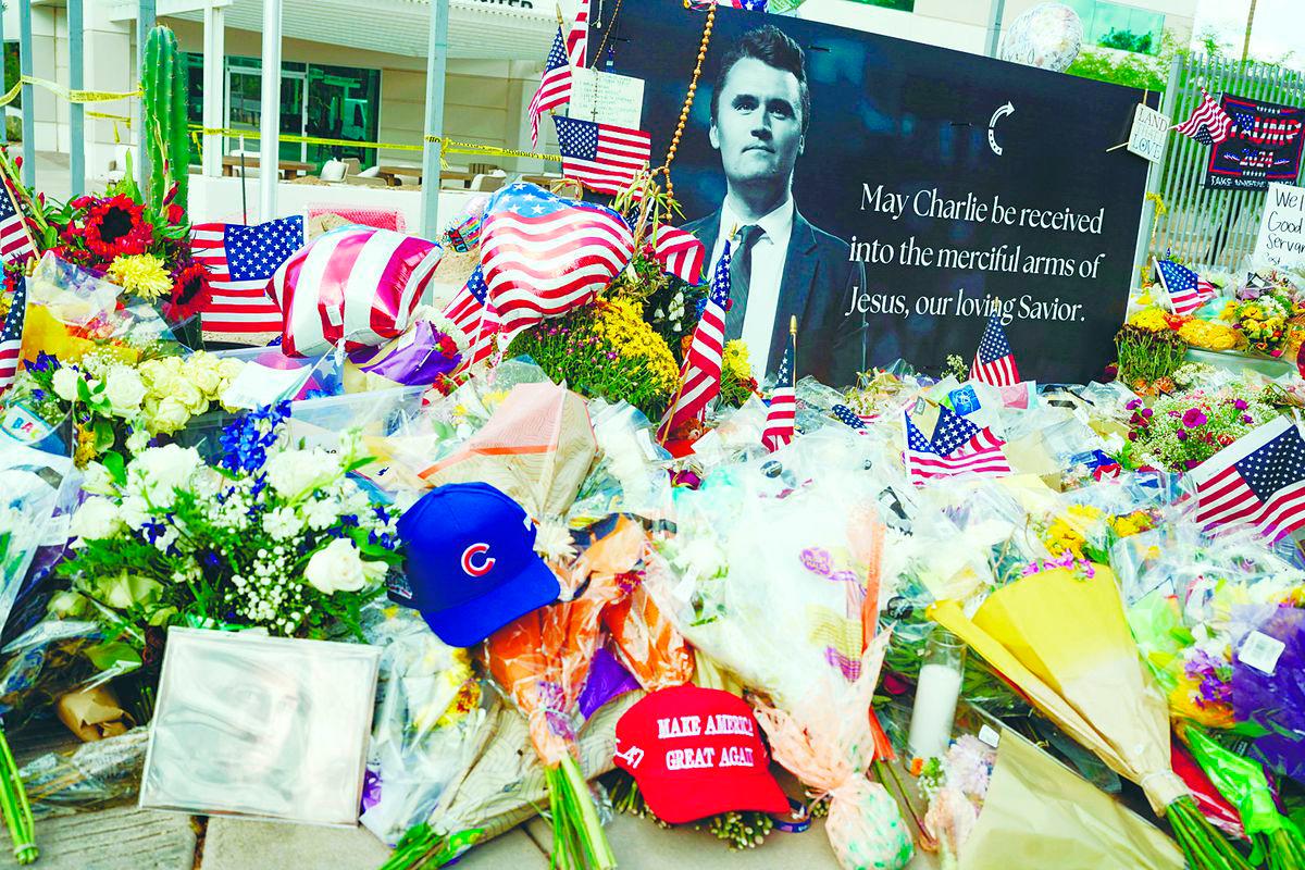 Flowers, photos and other items lie at a memorial for Kirk at the Turning Point USA headquarters in Phoenix, Arizona, US on Sept 12. – REUTERSPIC