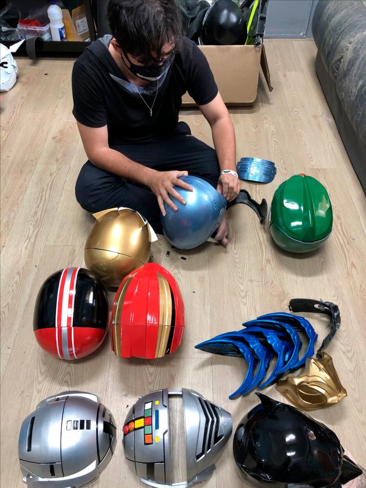 $!A team member at Toyriffic assembling a helmet.
