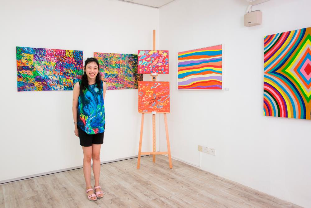 Lee with some of her artworks. - Picture courtesy of Tan Chi Yin
