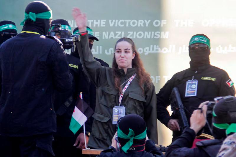 Female Israeli soldier Agam Berger gestures as she is released by Palestinian Hamas militants, as part of a ceasefire and a hostages-prisoners swap deal between Hamas and Israel, in Jabalia, in the northern Gaza Strip - REUTERSpix