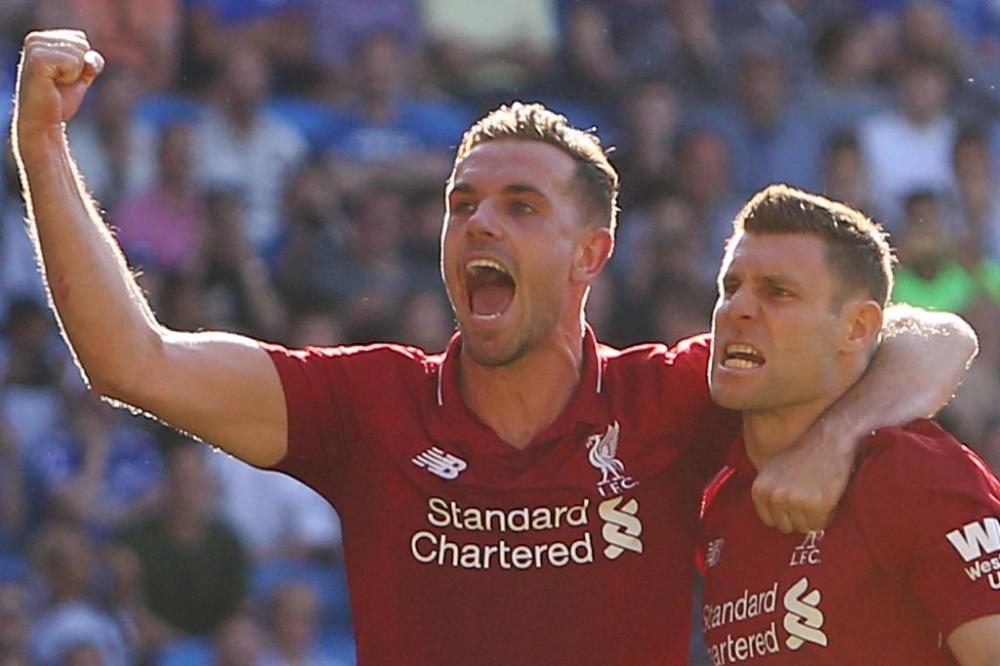 James Milner celebrates scoring Liverpool’s second goal against Cardiff. — AFP