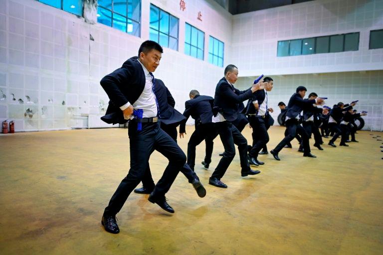 Students in matching black business suits toil from dawn until midnight at the bodyguard school in the eastern Chinese city of Tianjin. — AFP