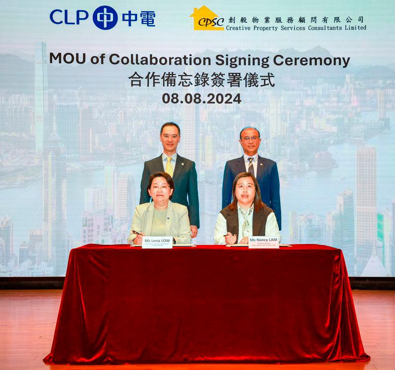 CLP Power Senior Director of Customer Success and Experience Ms Lena Low (left, front row) and Creative Property Deputy General Manager Ms Nancy Lam (right, front row) sign a Memorandum of Understanding to work together to enhance Creative Property’s resilience against extreme weather conditions and to promote energy saving, decarbonisation, digitisation, and community support, drawing on their combined strengths to combat climate change. CLP Power Managing Director Mr Joseph Law (left, back row) and Creative Property Director and General Manager Mr Stephen Poon (right, back row) witness the signing ceremony.