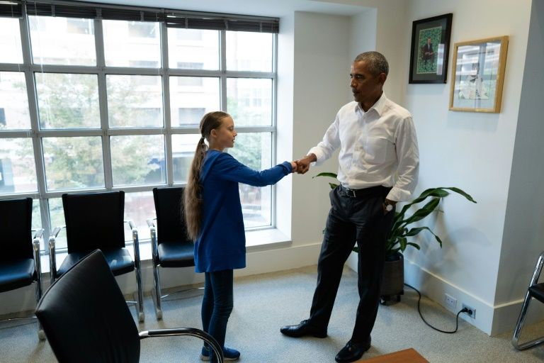 Former US president Barack Obama (R) met with climate activist Greta Thunberg in Washington. — AFP