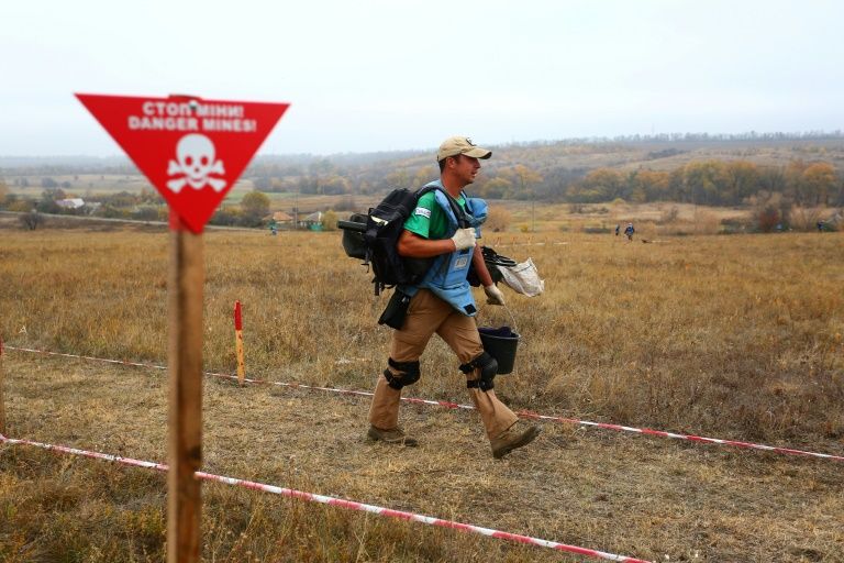 The pine-fringed village’s former pasture is cordoned off and marked by signs reading ‘Danger, mines’ in English. — AFP