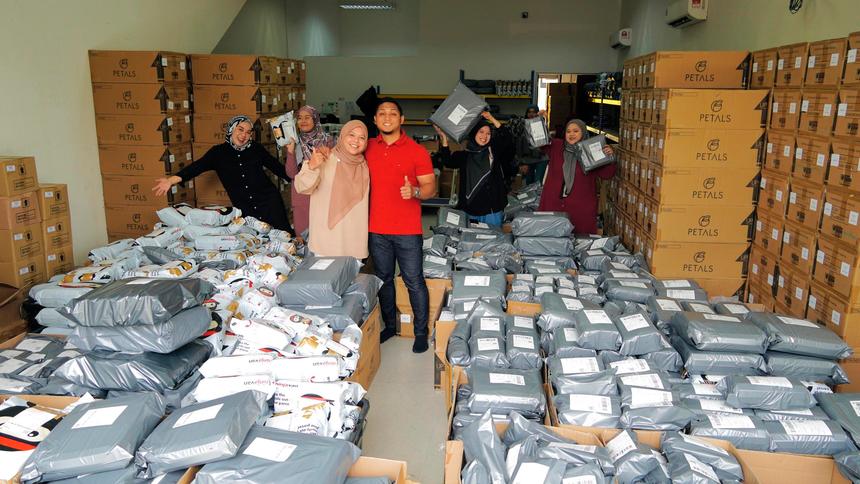 Khairul Azman, founder of Petals Malaysia with staff ready to deliver customers’ parcels.