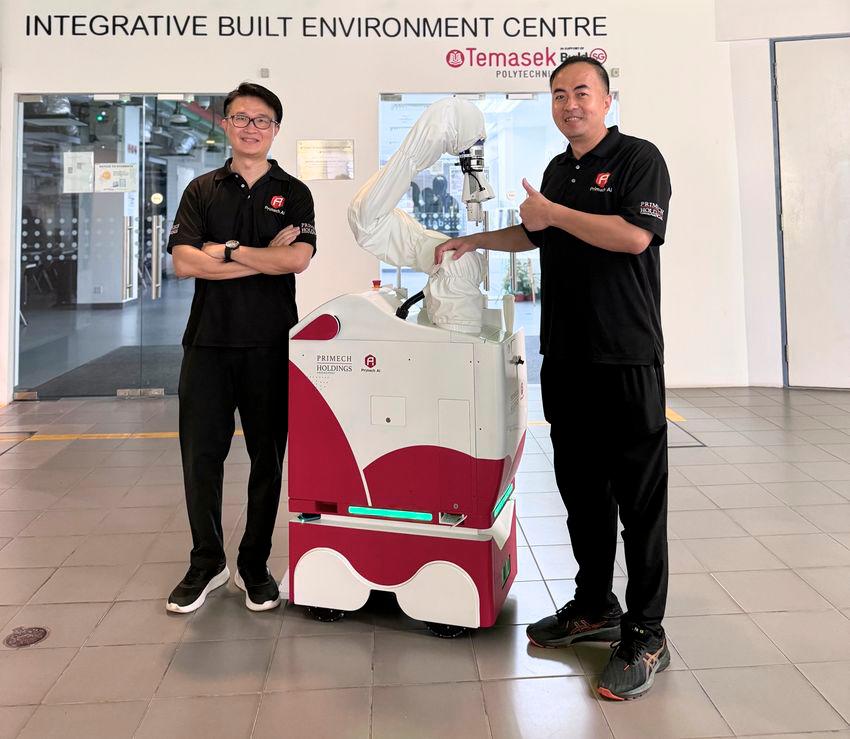 Primech AI’s COO, Charles Ng, and CTO, Richard Zhang, proudly commemorate the successful deployment of the Hytron robot at Temasek Polytechnic. Image: Primech AI