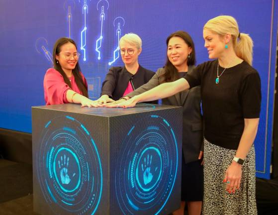 From right: Women’s Economic Empowerment and Private Sector Engagement programme specialist Amy Baum, Wong, Gatehosue and LeadWomen consulting and client services manager Liza Liew during the launch. – AMIRUL SYAFIQ/THESUN