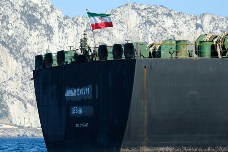 An Iranian flag flutters on board the Adrian Darya oil tanker, formerly known as Grace 1, off the coast of Gibraltar on August 18, 2019 before it set sail. — AFP