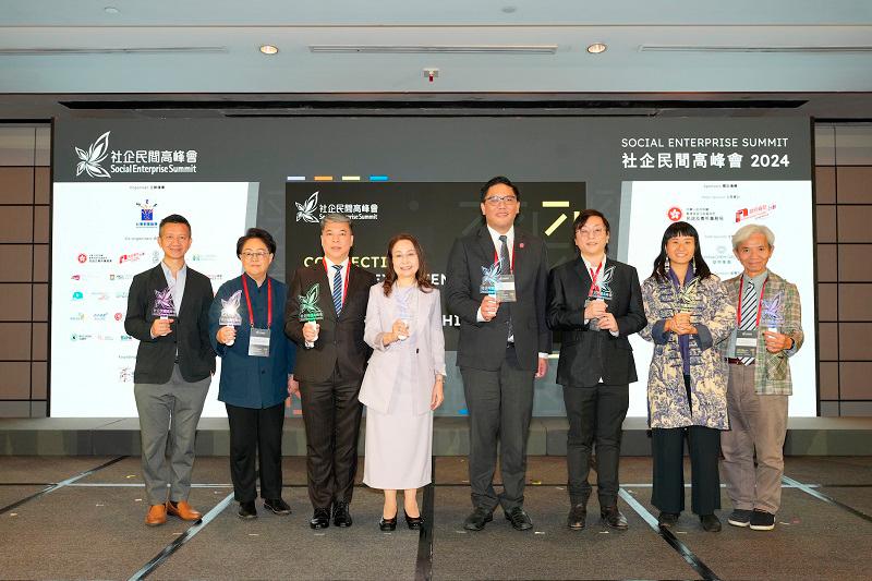 (From left to right) Mr. Francis Ngai and Ms. Ada Wong, JP, Deputy Chairs of the Organizing Committee of the Hong Kong Social Enterprise Summit; Mr. Alan Cheung, MH, Member of the Organizing Committee; Ms. Rebecca Choy Yung and Dr. CA Tse, Co-chairs of the Committee; Mr. Clarence Leung, Under Secretary for Home and Youth Affairs; Ms. Dorothy Lam; and Mr. Timothy Ma, MH, JP, Deputy Chair of the Committee, attended the SES 2024 Opening Session.