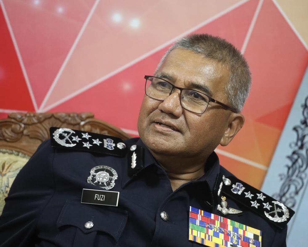 Inspector-General of Police Tan Sri Mohamad Fuzi Harun