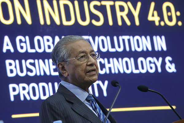 Prime Minister Tun Dr Mahathir Mohamed gives the keynote address at the International Conference on Industry 4.0 at SEGi University, Kota Damansara. — Sunpix by Asyraf Rasid