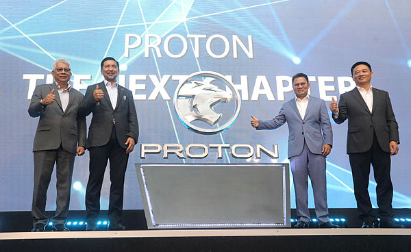 Proton deputy CEO Datuk Mohd Radzaif Mohamed (from left), DRB-Hicom Bhd chairman Datuk Mohammad Zainal Shaari, Syed Faisal and Li launching the new Proton logo at Proton Centre of Exellence Complex today. ASYRAF RASID/THE SUN