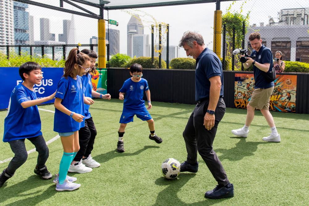 $!Chelsea Football Club legend Gianfranco Zola enjoying a friendly game with young beneficiaries from the Singapore Disability Sports Council on Saturday, 30 November, at the rooftop futsal court in Funan. The football coaching clinic was part of The Famous CFC, Chelsea’s flagship international fan engagement event presented by The Ascott Limited (Ascott), underscoring both organisations’ commitment to supporting local communities and promoting disability inclusion.