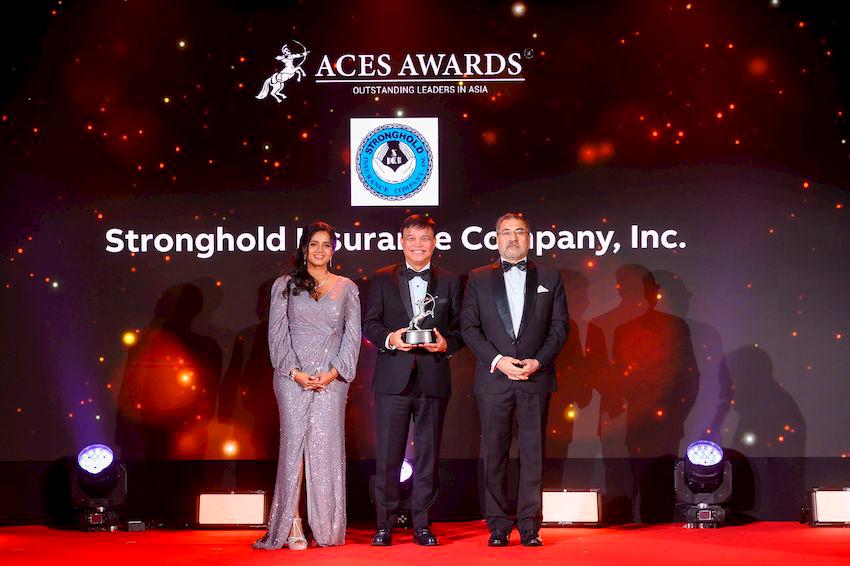 Romulo Jr. Delos Reyes, President &amp; General Manager of Stronghold Insurance Company, Inc. (centre), is honoured with the prestigious Outstanding Leaders in Asia award at the ACES Awards 2024 in Bangkok, Thailand. This momentous recognition was presented by Dr. Shanggari Balakrishnan, President of the ACES Awards (left), and Hemant Batra, Honorary Chairman of the ACES Awards (right), celebrating unparalleled leadership and excellence.