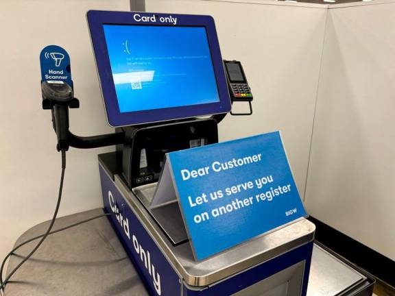A blue error screen on a register is seen at a departmental store affected by a cyber outage in Brisbane, Australia, July 19, 2024. AAP Image/Jono Searle via REUTERS