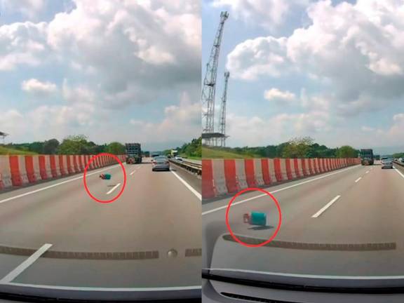 Gas cylinder falls from lorry on Johor highway, goes viral