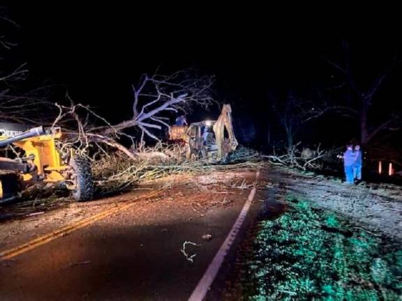 This handout image taken and released by the Missouri State Highway Patrol on March 15, 2025 shows debris on a road in the Bakersfield area, in Ozark County, Missouri, after severe storms hit the area. At least 33 people have been killed and dozens more injured when tornadoes and violent storms raked across the central United States, as forecasters warned more severe weather was expected on March 16. - AFP PHOTO / Missouri State Highway Patrol