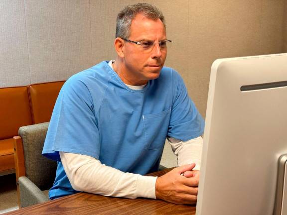 In this handout photo released by the California Department of Corrections, Erik Menendez appears before the parole board via teleconference on August 21, 2025, at the Richard J. Donovan Correctional Facility in San Diego, California. AFP PHOTO / HANDOUT / California Department of Corrections via AP “